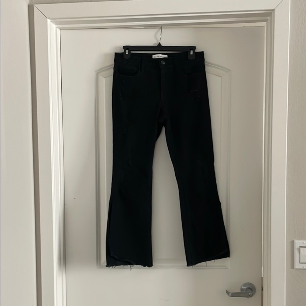 Black Flared Cropped Jeans with mild distressing and side slits